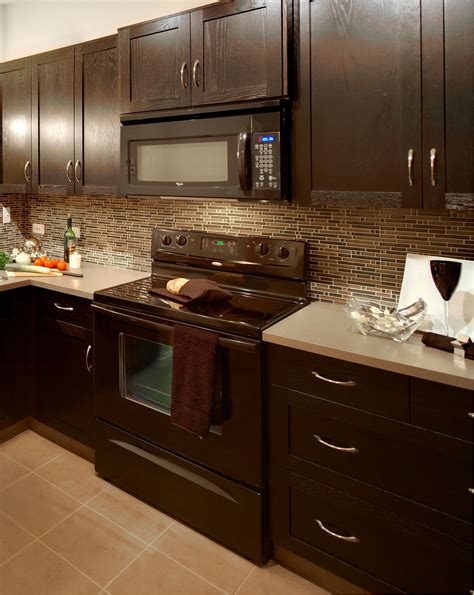 dark brown granite with light cabinets and stainless steel appliances|brown granite countertop ideas.